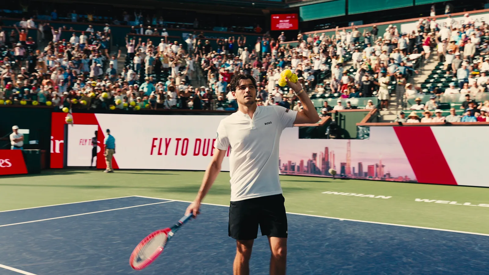 Tennis player acknowledging the crowd at a stadium court