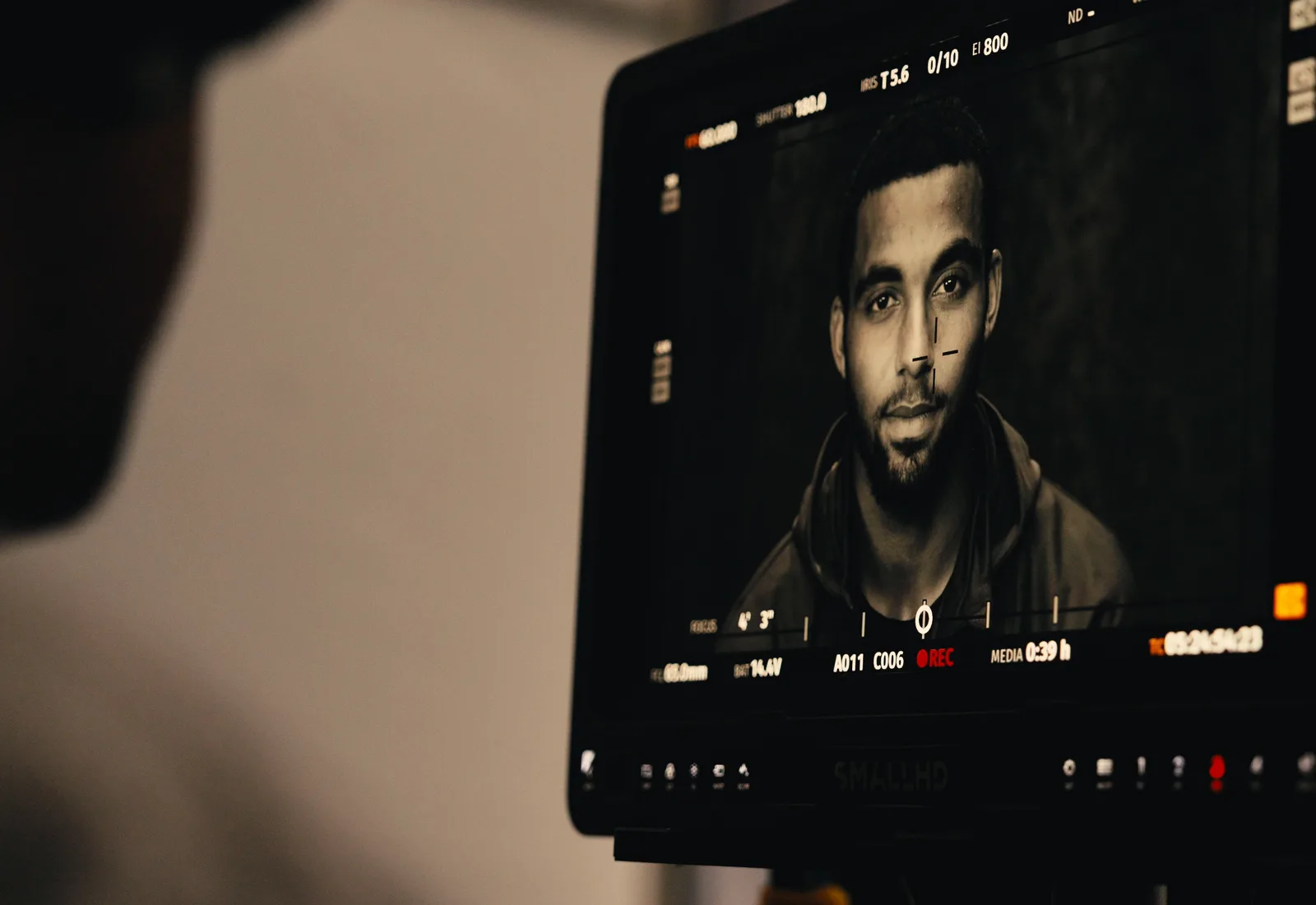 Director's monitor showing an athlete portrait